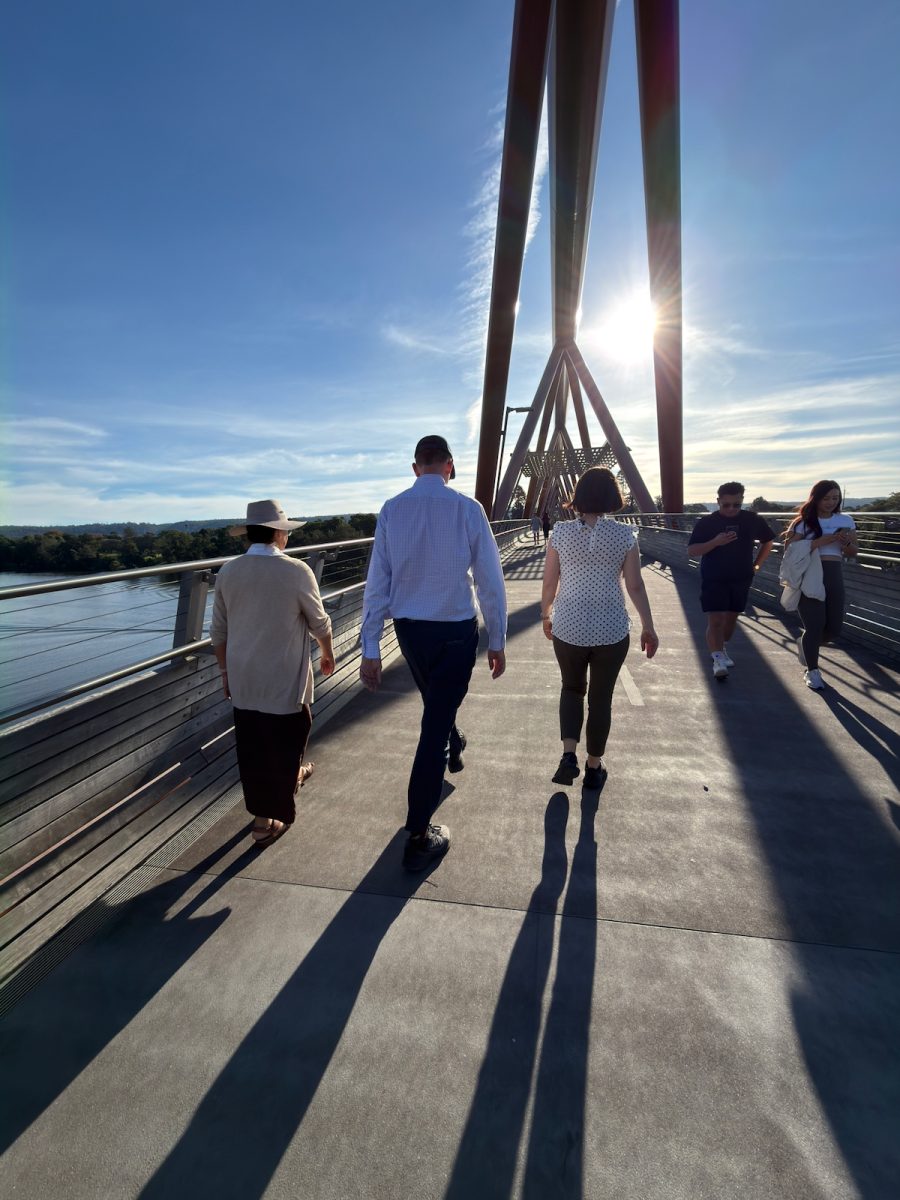 Three friends enjoying the benefits of walking together during a daily fitness routine